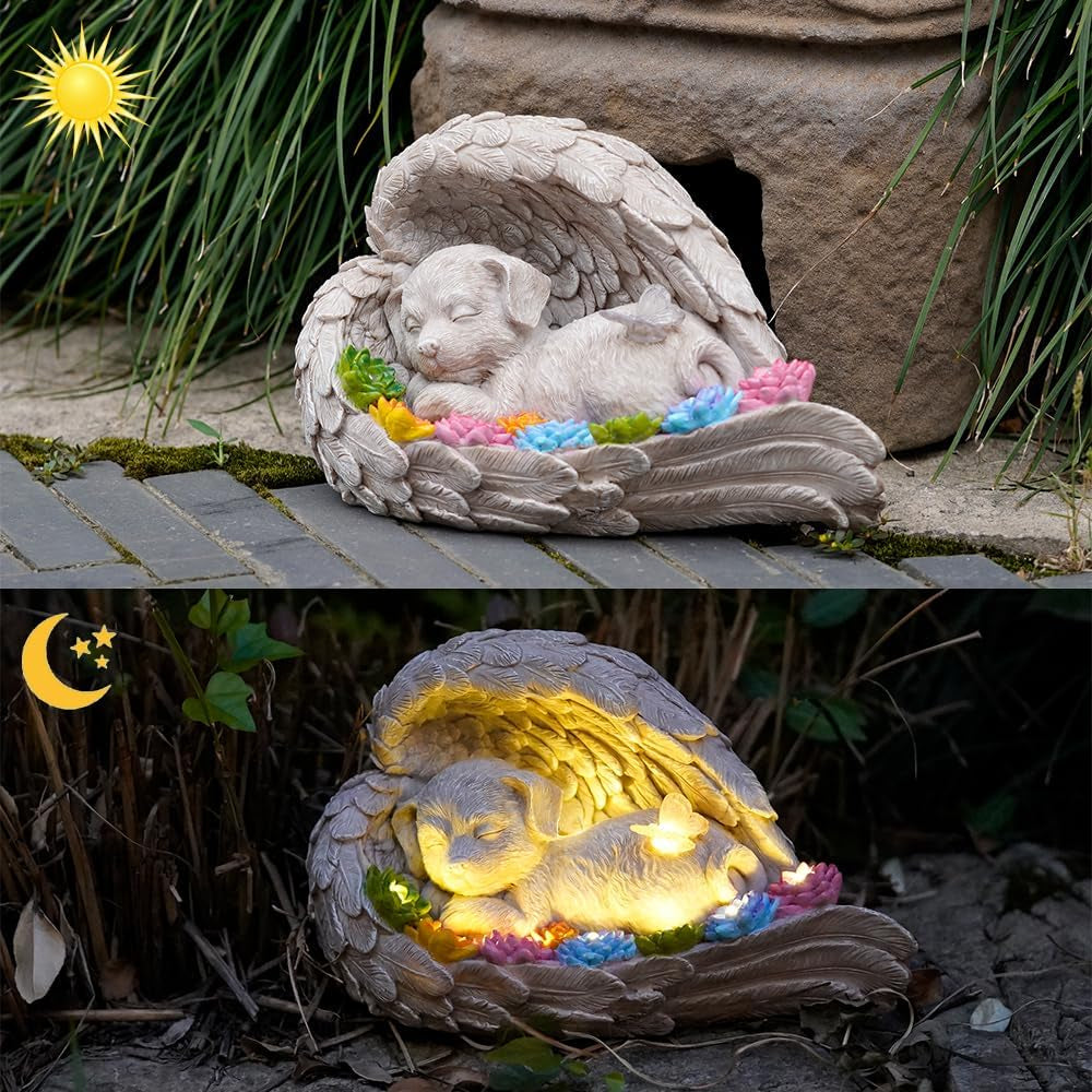 Dog memorial stone with solar angel statue for outdoor remembrance.