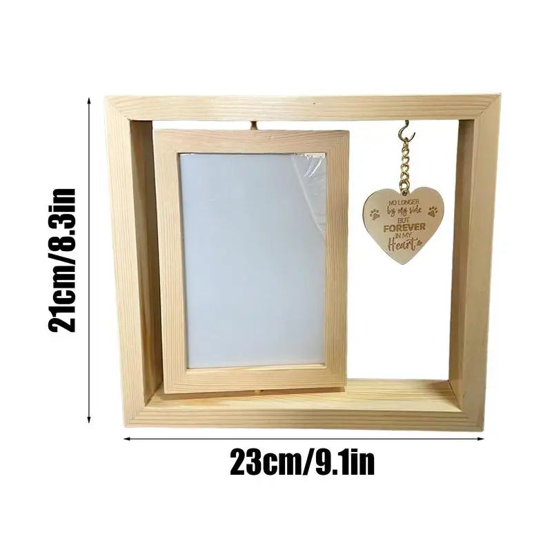 Rotating pet memorial photo frame with heart pendant.