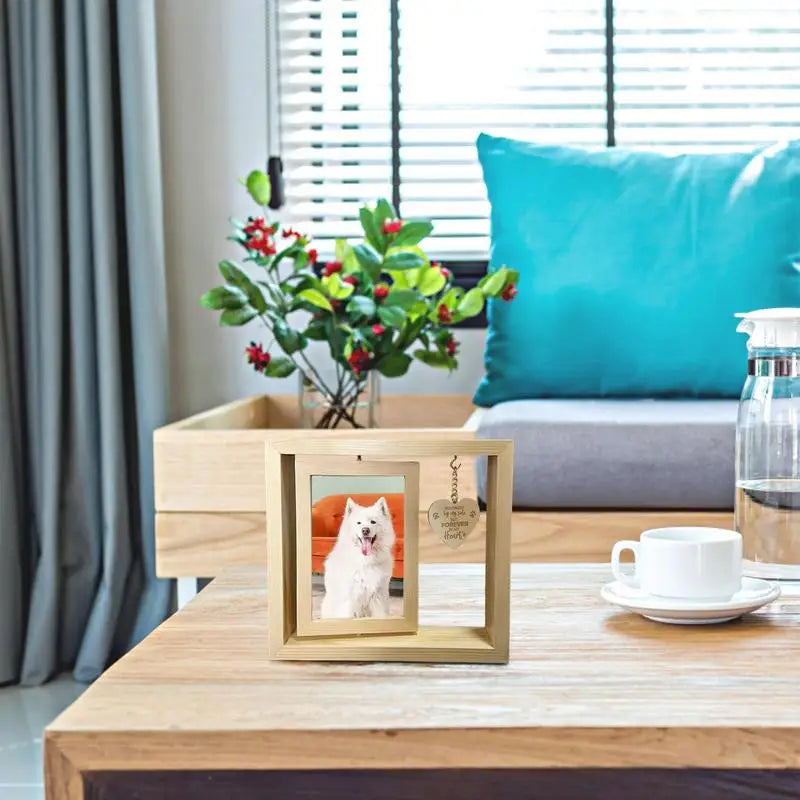 Rotating pet memorial photo frame with heart pendant.