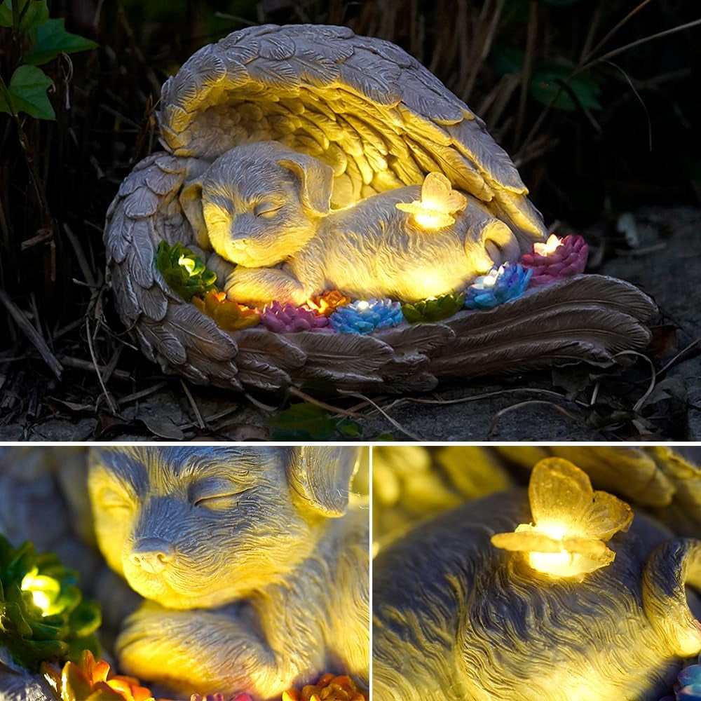 Dog memorial stone with solar angel statue for outdoor remembrance.