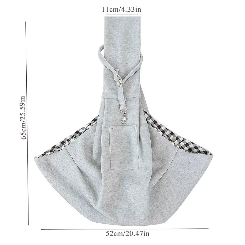 Soft-sided pet carrier with an adjustable crossbody shoulder strap.
