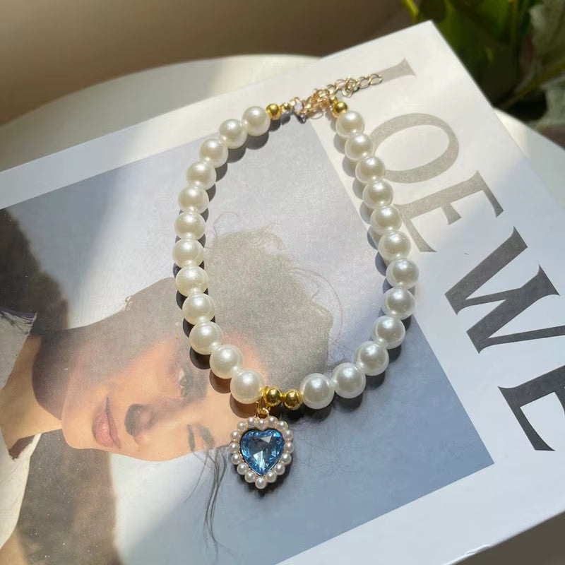 Pearl pet necklace with blue heart pendant