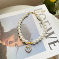 Pearl pet necklace with rhinestone heart pendant