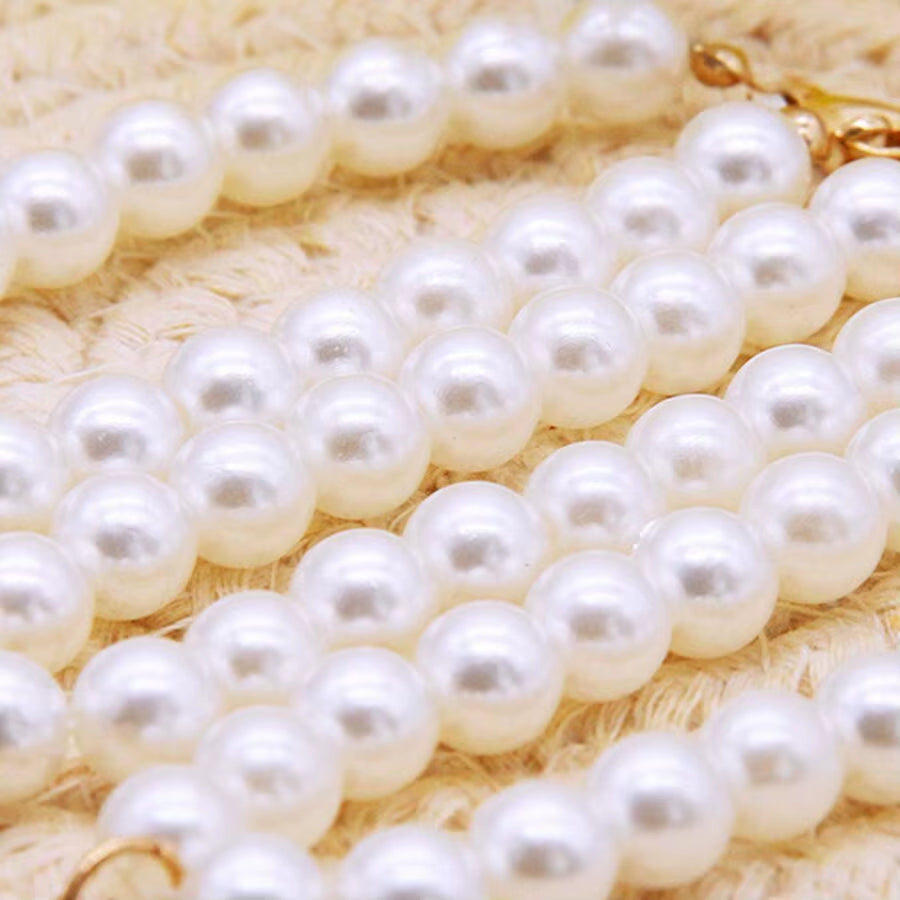 Close-up of the pearl bead necklace