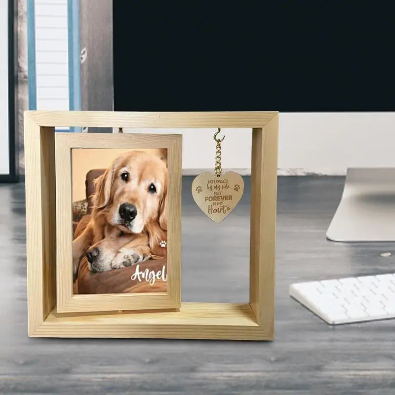Rotating pet memorial photo frame with heart pendant.