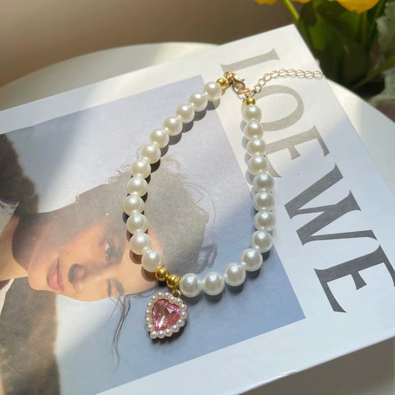 Pearl pet necklace with pink heart pendant