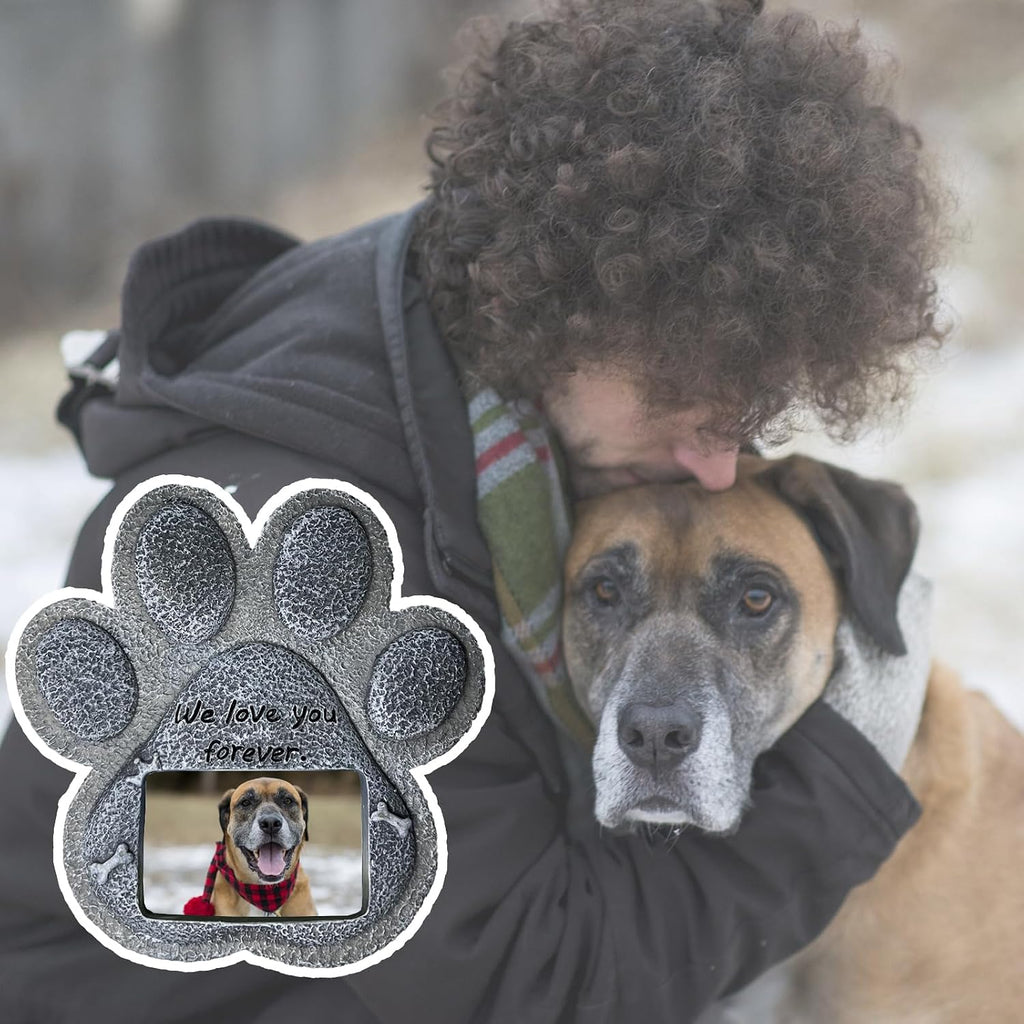 Paw-shaped pet memorial stone with engraved remembrance message.