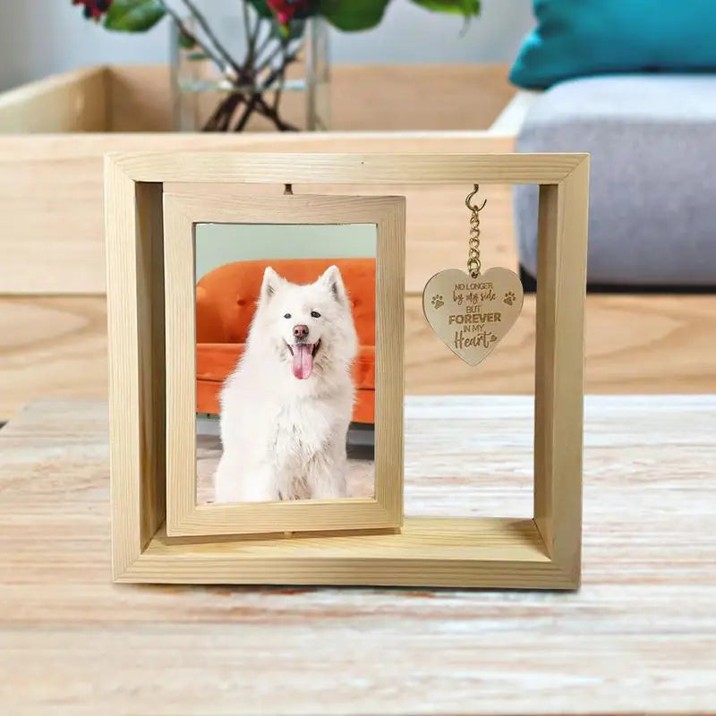 Rotating pet memorial photo frame with heart pendant.